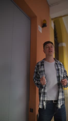 young man standing outdoors near a building