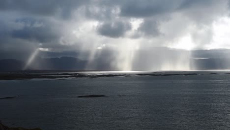 Huge-storm-clouds-on-a-rainy-day,-over-the-horizon-and-cliffs-of-the-vesteralen-in-Norway