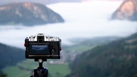 fujifilm camera on a tripod out in the landscape of slovenia taking photos