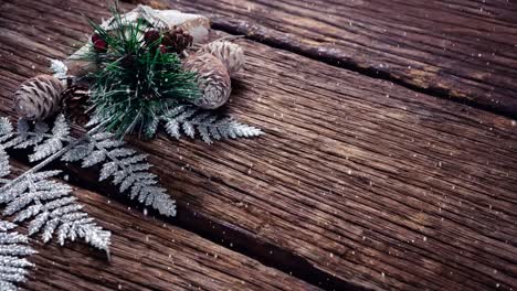 falling snow with christmas decoration on wood