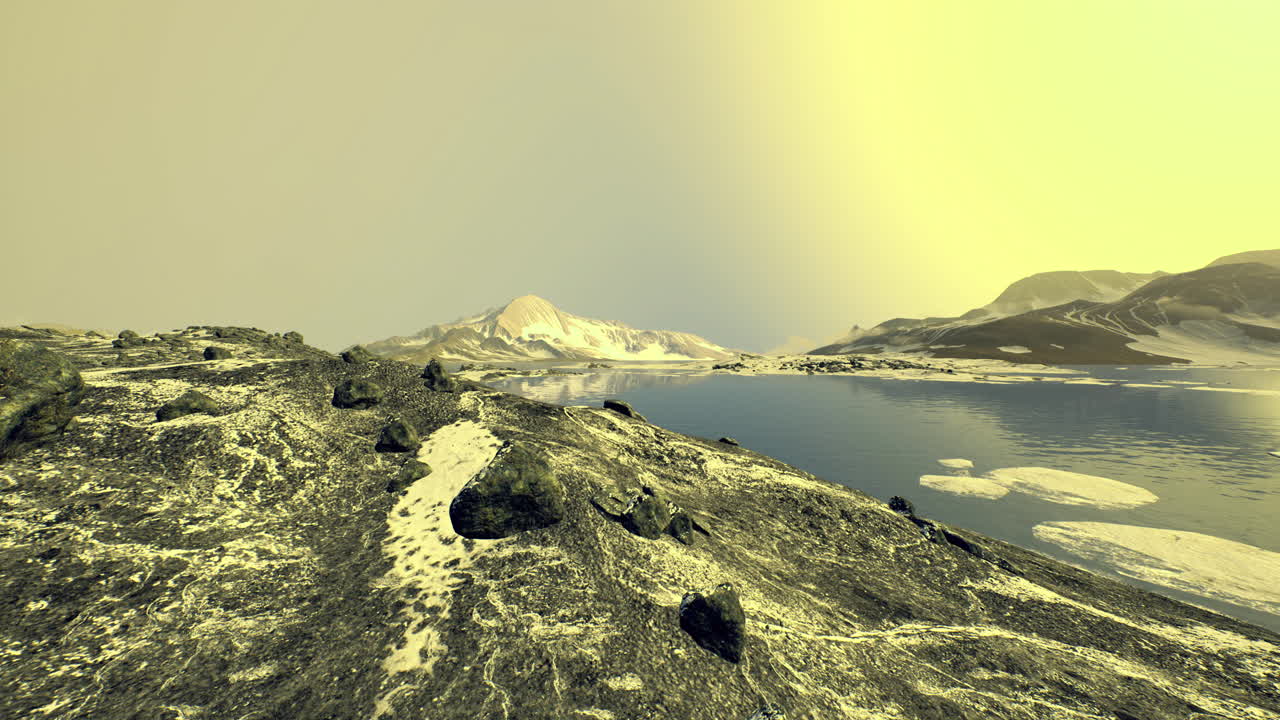 Vast rocky landscape near icy waters with distant mountains under a pale sky