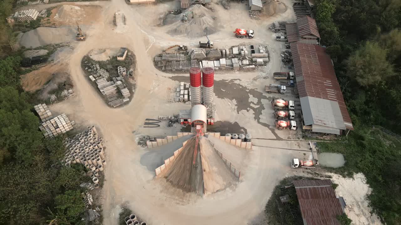 Aerial View of a Large Concrete Batching Plant with Silos and Heavy Machinery