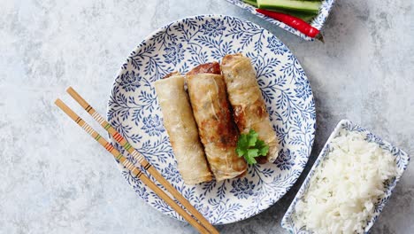 Orginal-asian-deep-fried-spring-rolls-placed-on-beautiful-oriental-style-plate