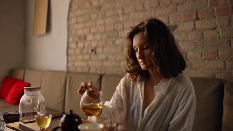 woman pouring tea during a tea ceremony