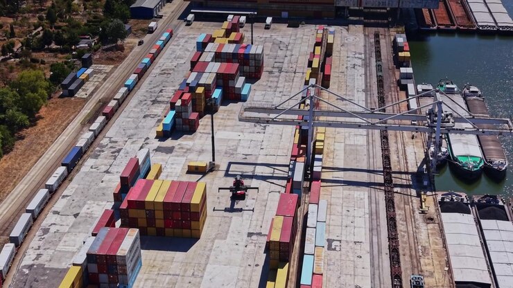 Cargo containers arranged at a shipping yard on a sunny day