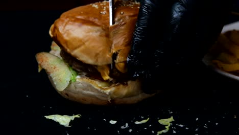 cuting burger with knife