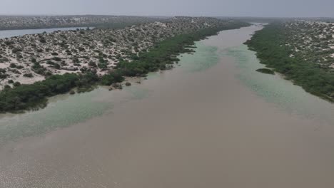 Panoramic-aerial-view-of-Botar-lake-in-white-desert-of-Sindh,-Pakistan