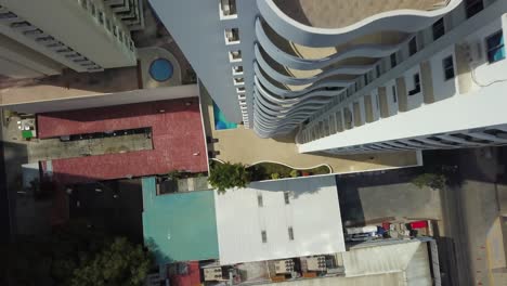 Descending-Aerial-top-down-of-Residential-building-with-pool-in-Panama-City