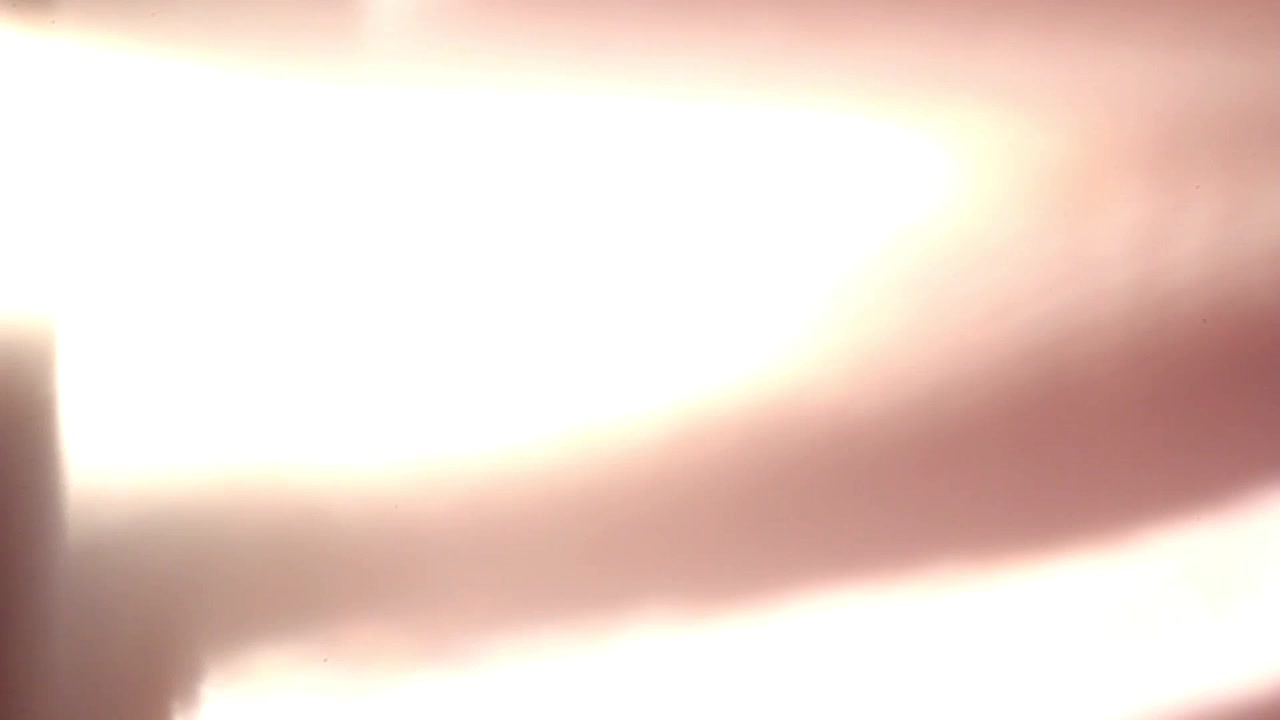 Cinematic Warm Light Leak and Lens Flare Transition