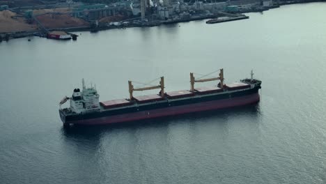 bulk carrier sailing across vancouver harbour in canada