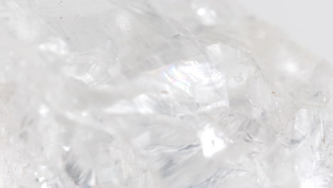 Macro-Shot-Of-Rough-Transparent-Quartz-Rock-Spinning-Around