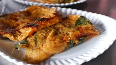 hor-mhok, thai traditional grilled curry fish cake, made from fresh fish mixed with curry paste wrapped in banana leaf and grill to cook