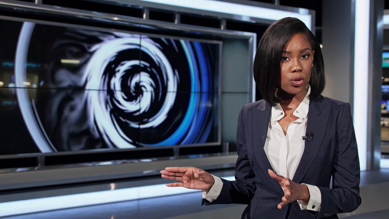 Female News Anchor Presenting in a Modern Television Studio