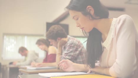 Animation-of-light-background-over-diverse-students-during-exam