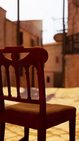 old wooden chair in a deserted city street