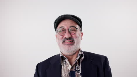 portrait of a smiling man with glasses and hat