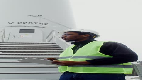 wind turbine technician inspecting