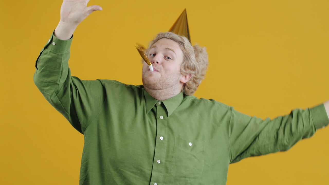 Man Celebrating with Party Hat