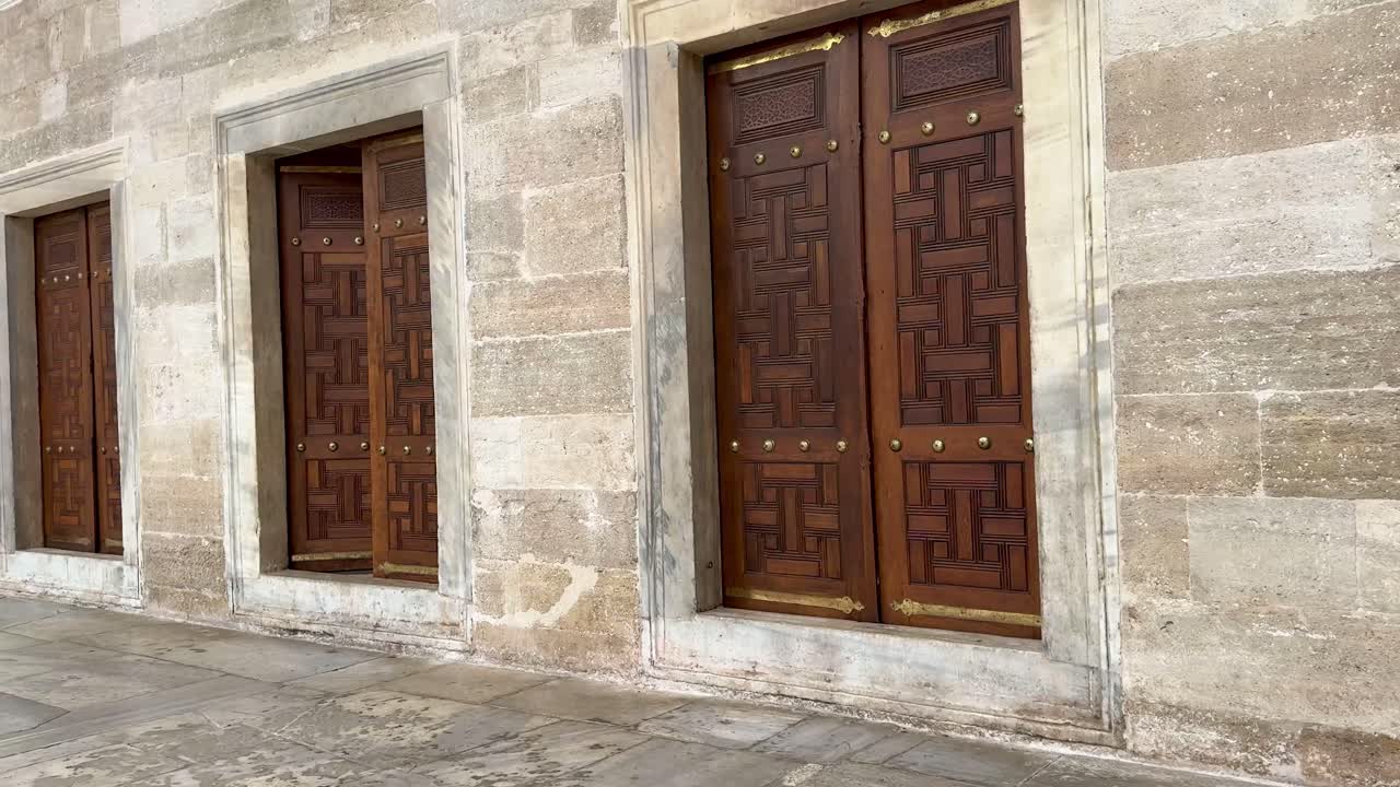 Wooden doors with brass accents at Istanbul’s Fatih Sultan Mosque.