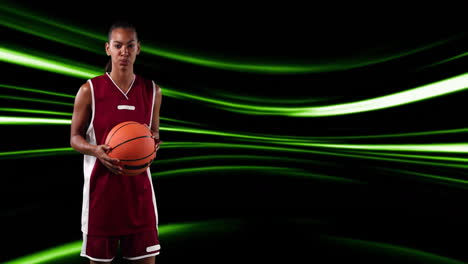 holding basketball, athlete standing over green light streaks animation