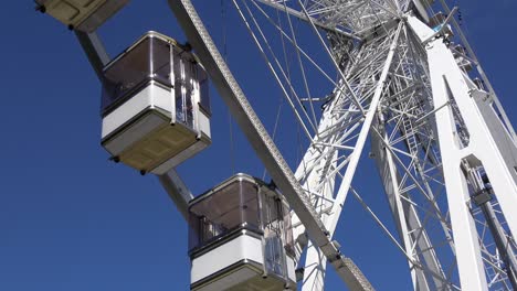 4k. cabins of a ferris wheel or big wheel that is spinning. passenger car