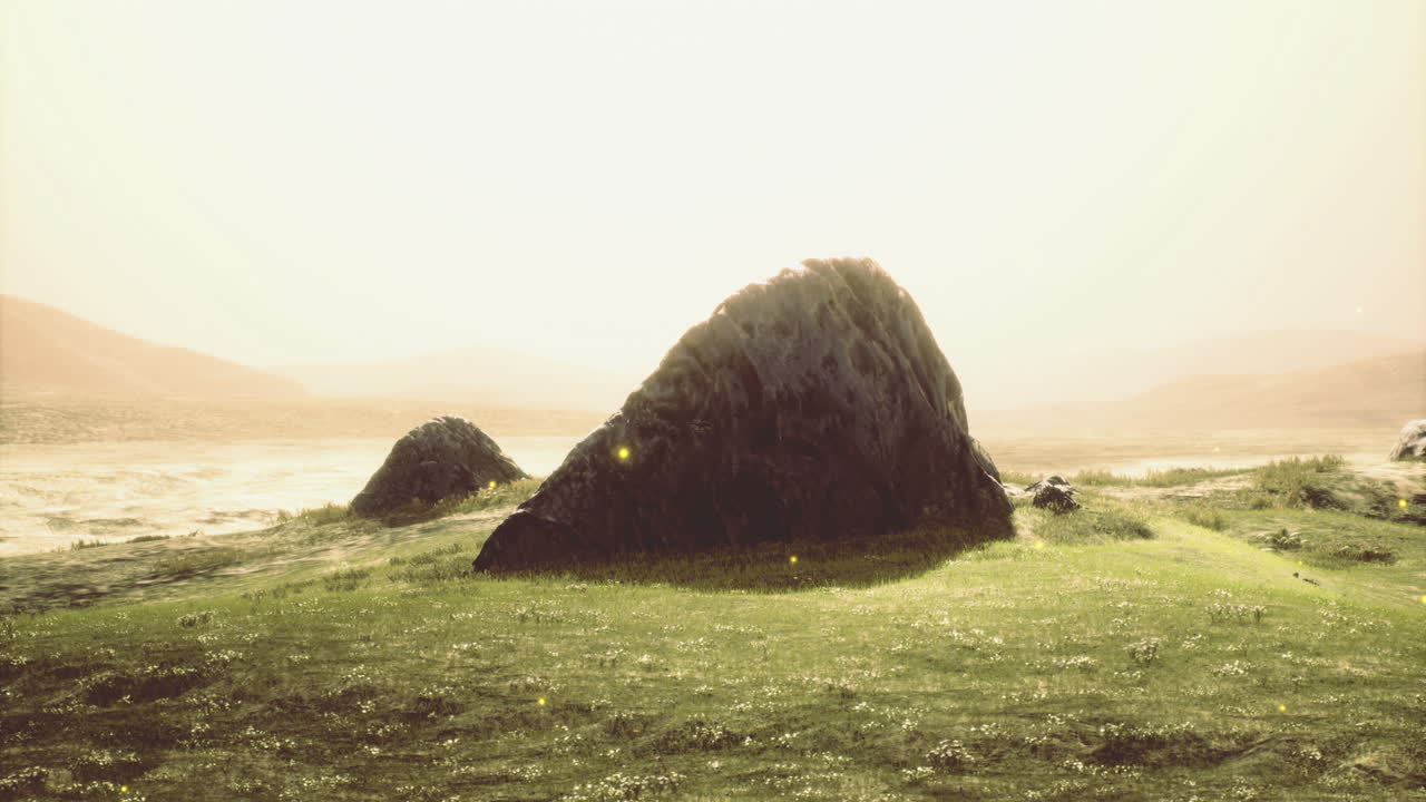Serene landscape with majestic boulders under a golden sunset light