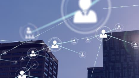 network of profile icons and spot of light against tall buildings in background