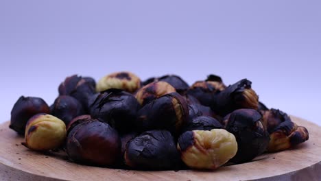 Fresh-roasted-chestnuts-rotating-on-a-turntable