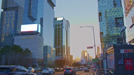 Big-city-town-in-South-Korea,-Seoul,-Gangnam-traffic-with-cars,-buses,-skyscrapers-and-big-urban-architecture