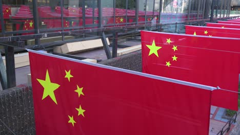 flags of the people's republic of china and the hong kong sar are displayed ahead of july 1st anniversary of hong kong's handover to china in hong kong