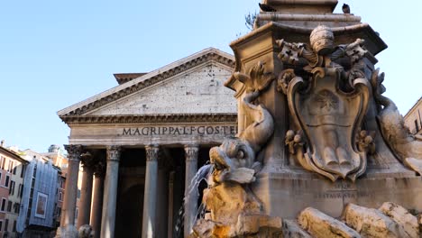 fountain of the pantheon and the pantheon in the background