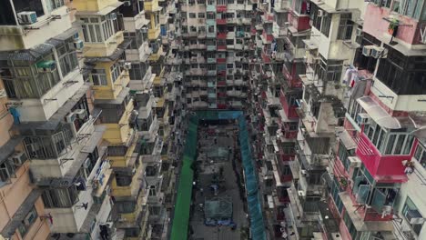 aerial of an old apartment complex called yick fat on quarry bay, hong kong, china