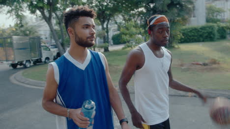 basketball friends walking along the street and talking