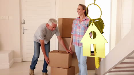 llaves de la casa y llaves colgando con la casa en el fondo