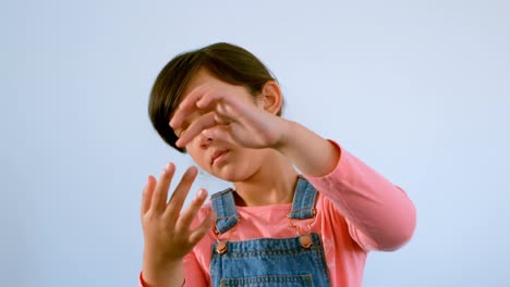 Cute-Caucasian-girl-counting-on-fingers-against-whiteboard-in-classroom-at-school-4k