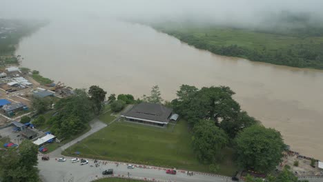 foggy morning beautiful drone view of sri aman town at batang lupar river, during regatta and pesta benak,sarawak, borneo.
