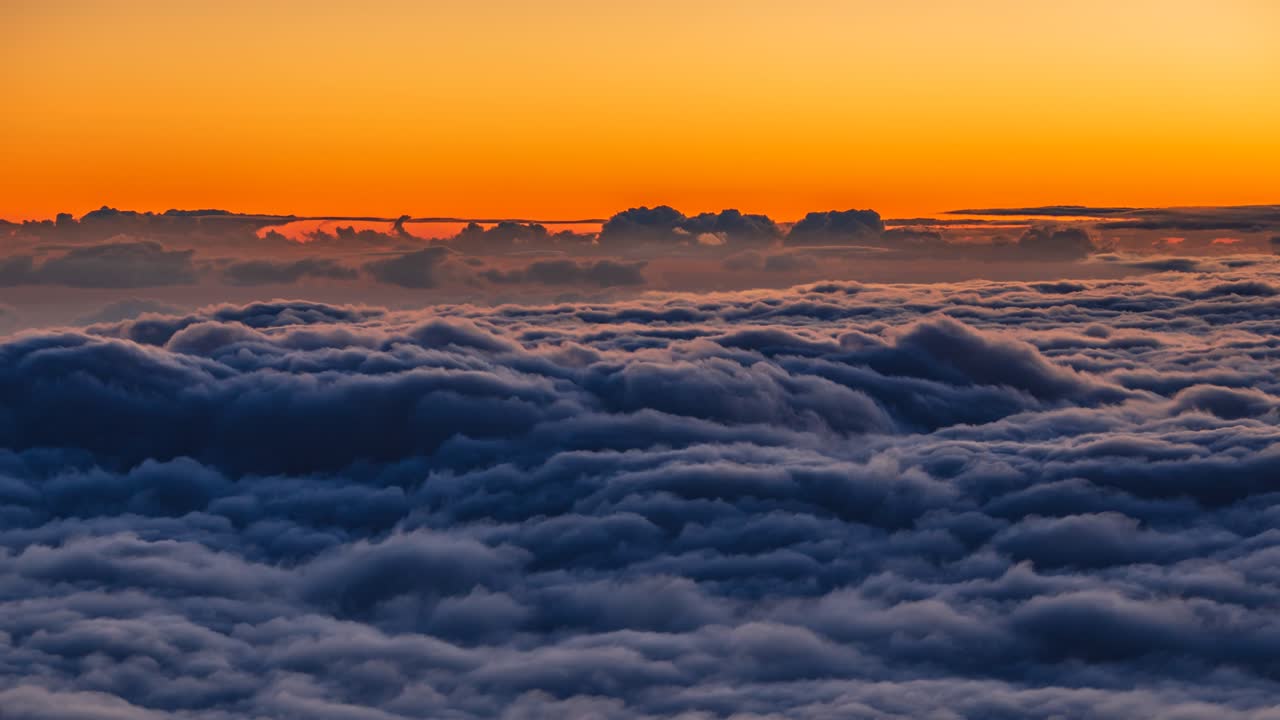 Cloud inversion during sunset seen from Teide National Park. Video with camera motion.