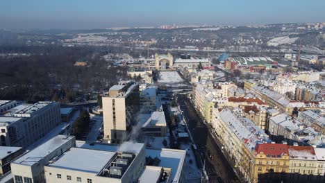 Prague-Exhibition-Grounds-or-Vystaviste-Praha-in-Holesovice,-aerial-drone-view-near-Stromovka-park,-winter-day,-Czech-Republic