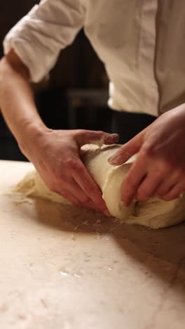 chef kneading dough