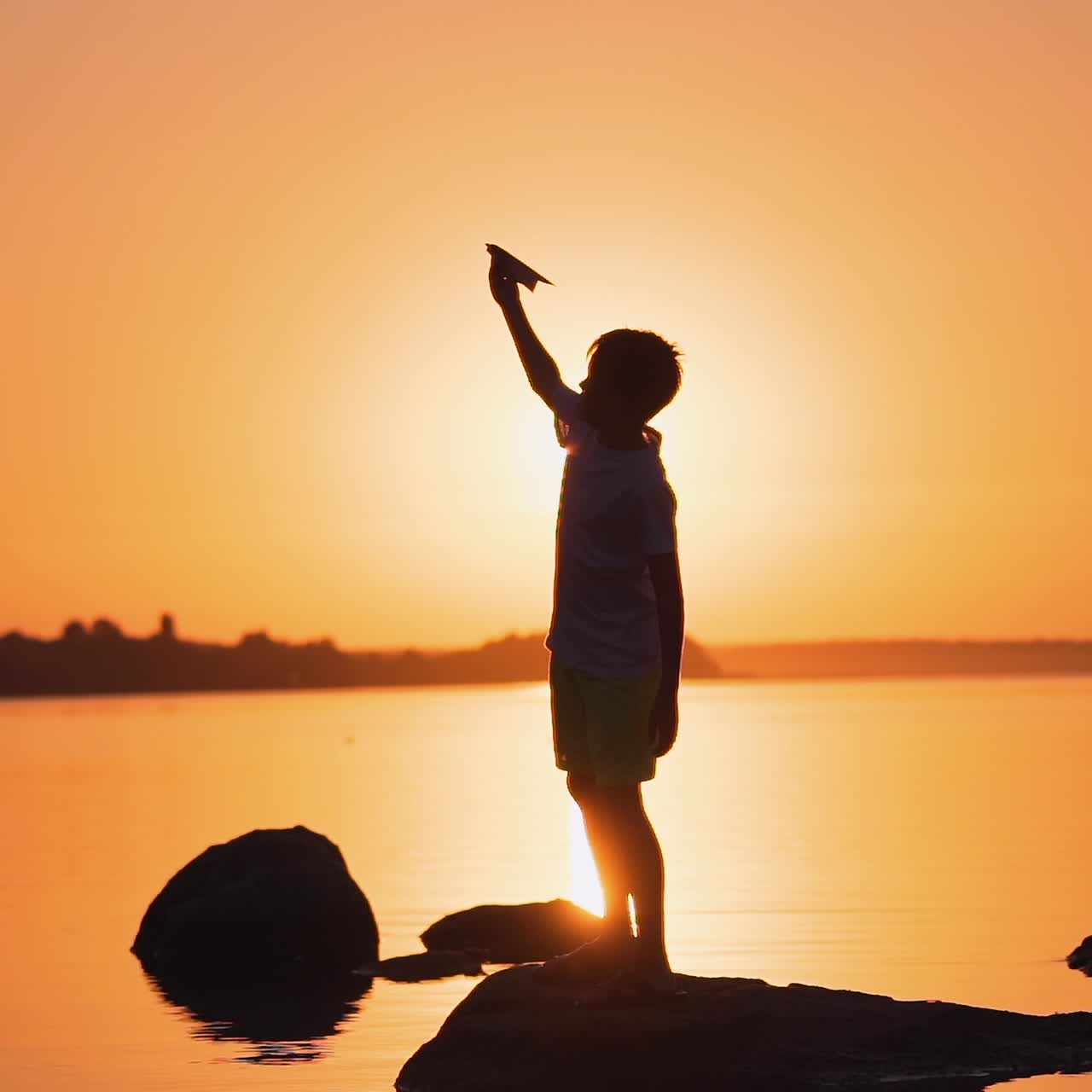 Boy resting near the water