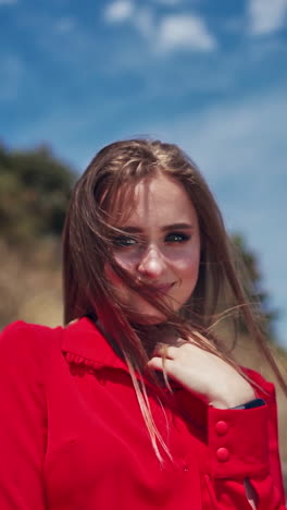 beautiful female model outdoor. portrait view of young woman posing in beautiful mountains. vertical video