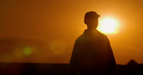 Farmer-Using-Digital-Tablet-At-Farm-Against-Sunset-10