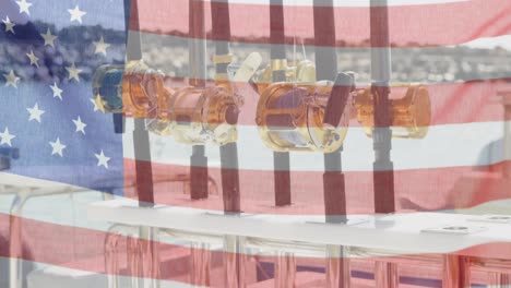 bandera estadounidense ondeando contra el cierre de las cañas de pescar en el fondo