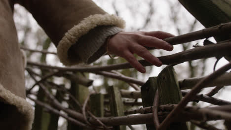 hands touching natural stairway going up to treehouse