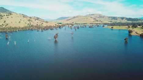 rising aerial footage of the swollen floodplains of the mitta mitta river near where it enters lake hume, in north-east victoria, australia