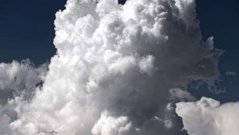 a timelapse of clouds reshaping in the blue sky