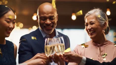 celebratory gathering of friends raising glasses in toast, capturing joyful expressions and a cheerful atmosphere with sparkling drinks and warm smiles