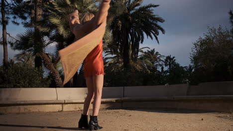 Young-woman-whirling-outdoors.