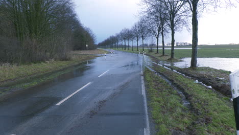 a country road is flooded after heavy rainfall