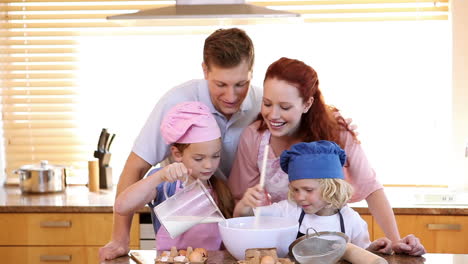 Family-standing-while-cooking-together